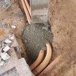 laying pipes in petrol forecourt