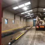 laying concrete floor in warehouse