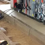 laying ground bricks in petrol station forecourt