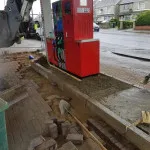 laying ground bricks in petrol station forecourt