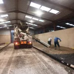 laying concrete floor in warehouse