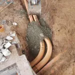 laying pipes in petrol forecourt