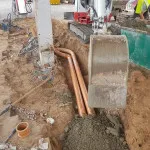laying pipes in petrol forecourt