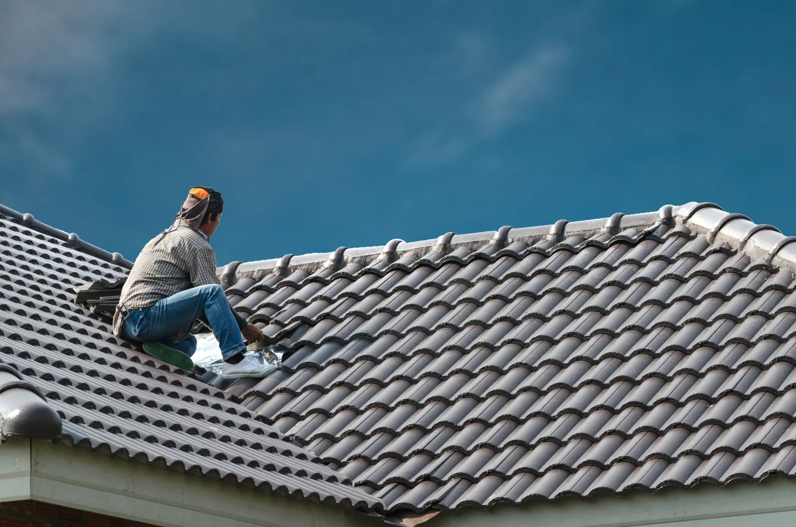 roofer installing tiles
